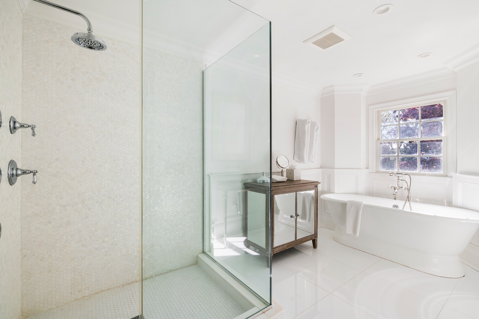 51 Jagger Lane Westhampton, NY 11977 - Photo 8 of 17 a spacious bathroom with a double vanity sink a mirror and a bathtub