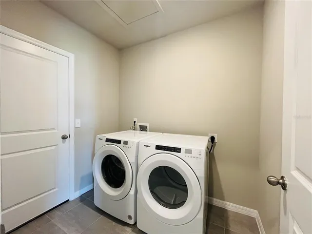 a utility room with dryer and washer