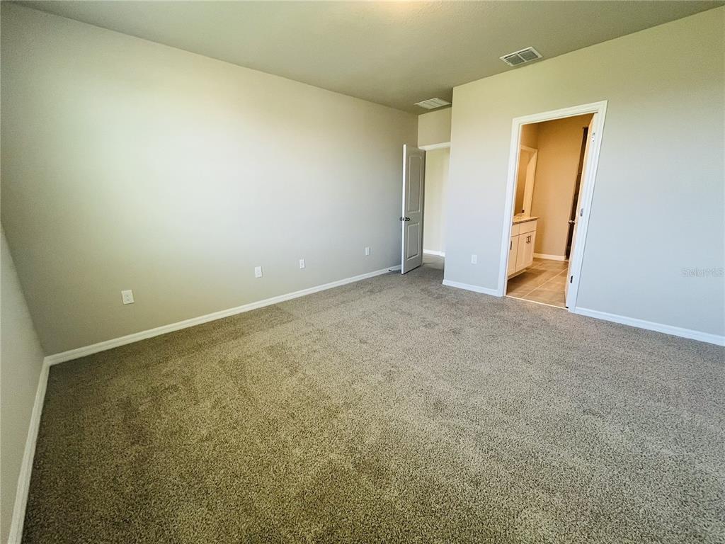 1061 Oak Vly Drive Auburndale, FL 33823 - Photo 6 of 16 an empty room with closet and a window