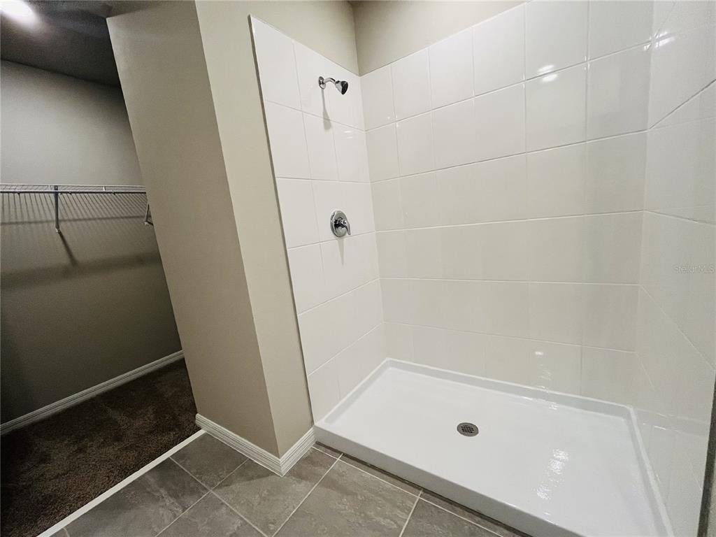 1061 Oak Vly Drive Auburndale, FL 33823 - Photo 9 of 16 a bathroom with a glass shower door