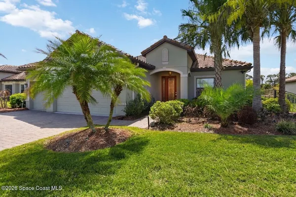 a view of a yard with a house and a garden