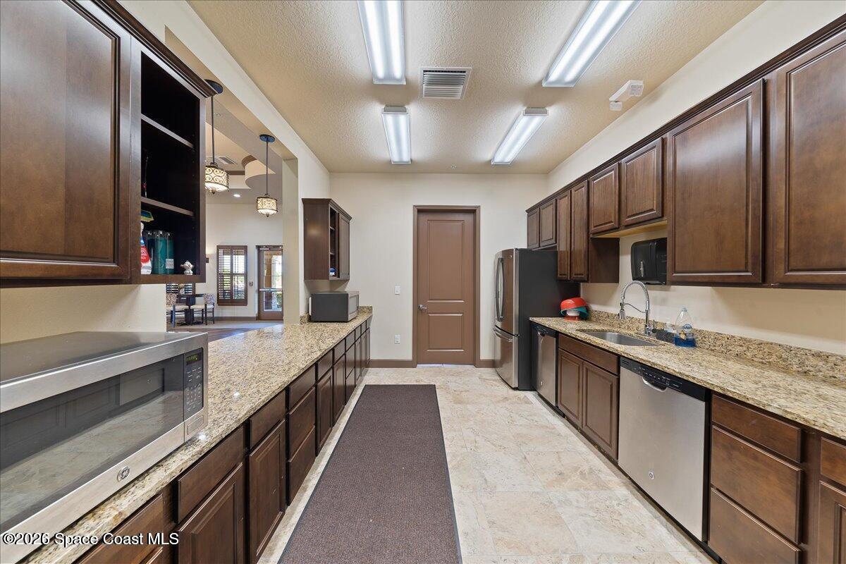 3333 Rushing Waters Drive West Melbourne, FL 32904 - Photo 70 of 72 Clubhouse Kitchen