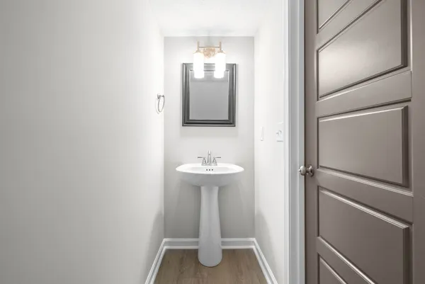 a bathroom with a sink and mirror