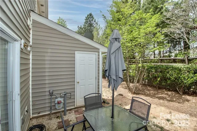 a backyard of a house with outdoor seating