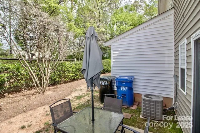 a backyard of a house with seating space