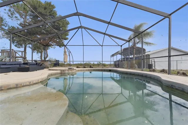 a view of a swimming pool with a patio