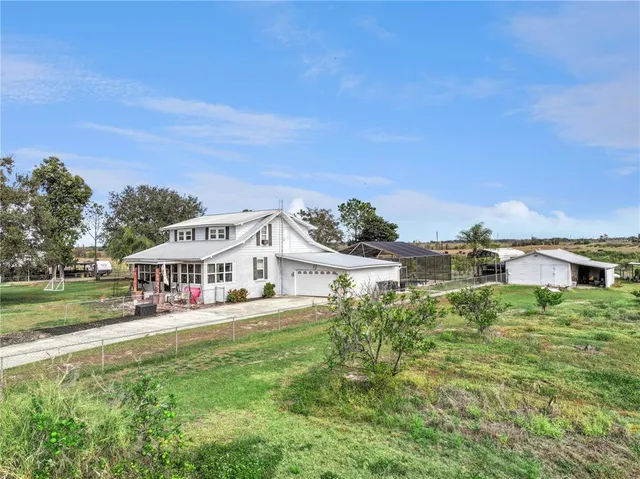 an aerial view of a house with a patio