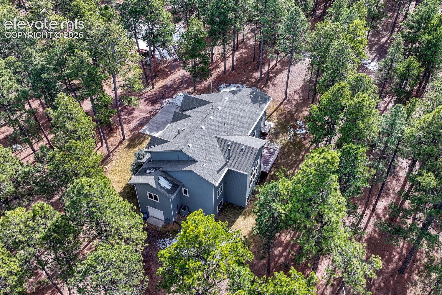 15430 Bar X Road Colorado Springs, CO 80908 - Photo 45 of 50 Aerial view of home and treed lot.