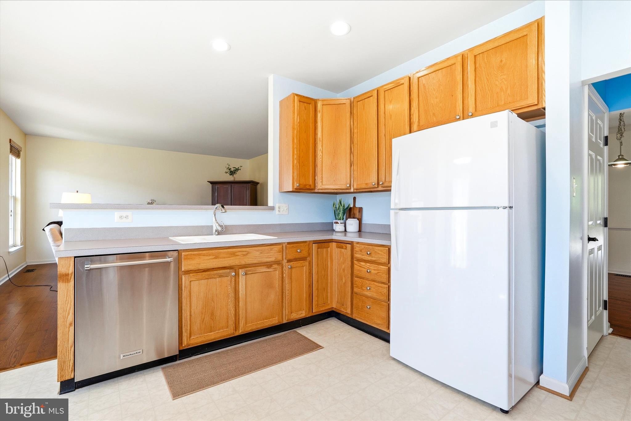 9009 Bealls Farm Road Frederick, MD 21704 - Photo 7 of 41 a kitchen with stainless steel appliances a refrigerator sink and cabinets