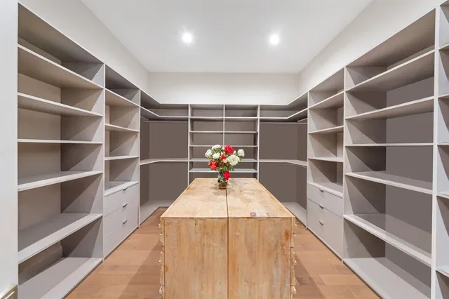 a bathroom with a double vanity sink and mirror