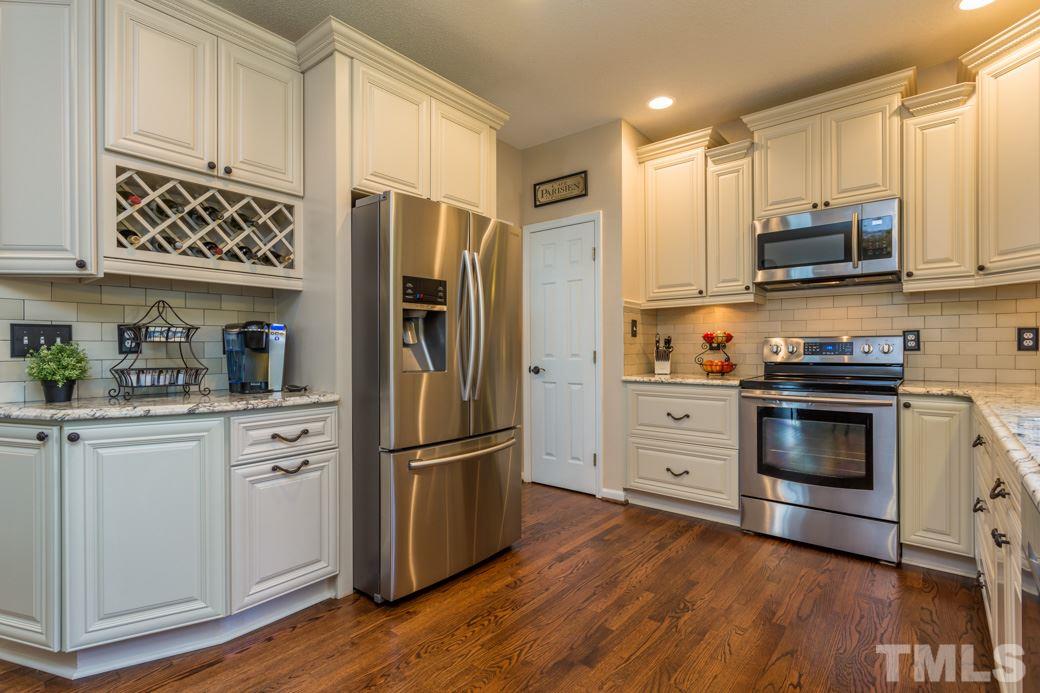 6936 Lamarsh Court Raleigh, NC 27617 - Photo 3 of 25 New cabinets with wine rack