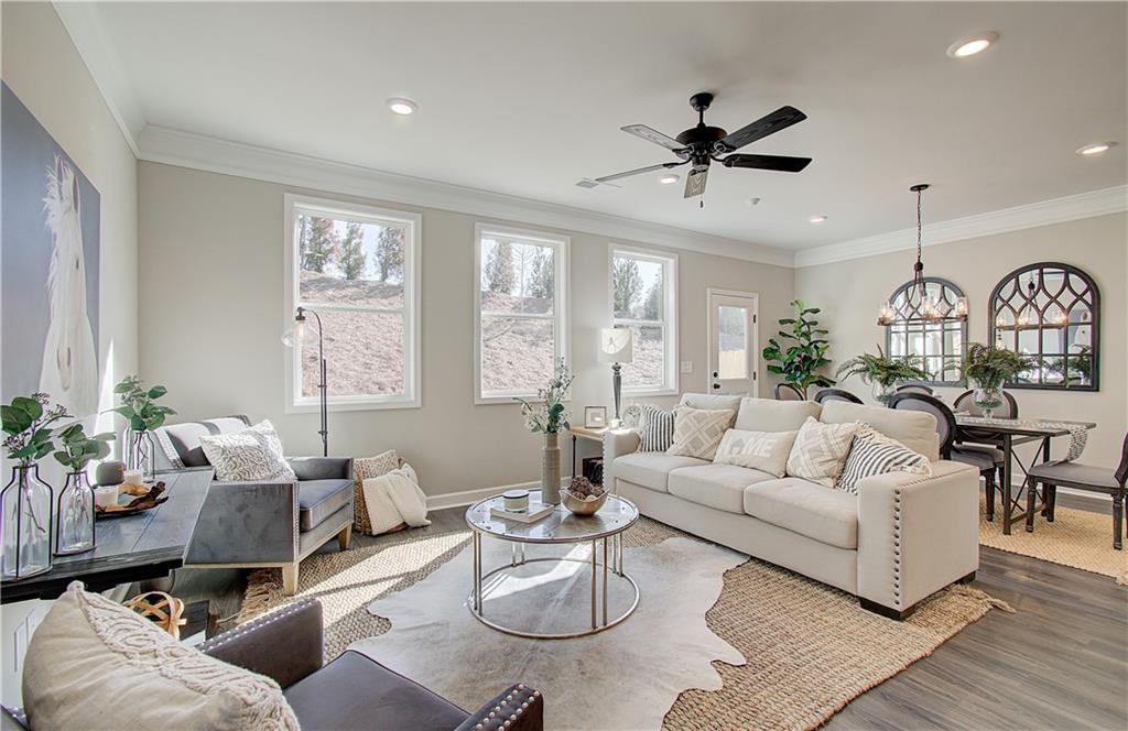 764 Trevett Way Marietta, GA 30066 - Photo 1 of 1 a living room with furniture a wooden floor and a window