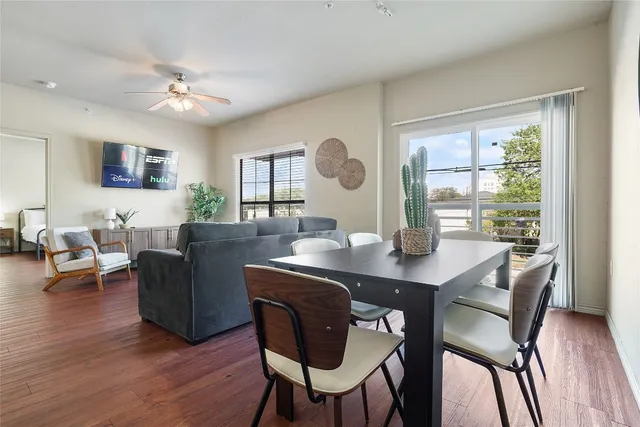a view of a dining room with furniture and wooden floor