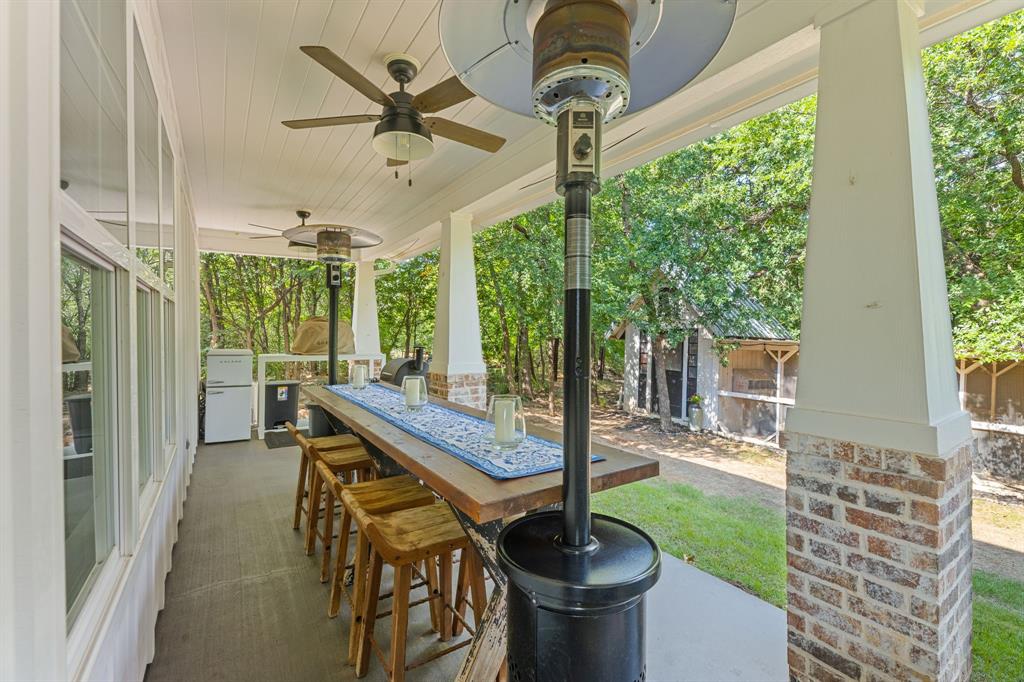 665 Chinn Chapel Road Copper Canyon, TX 75077 - Photo 10 of 26 a view of a porch with furniture and a yard