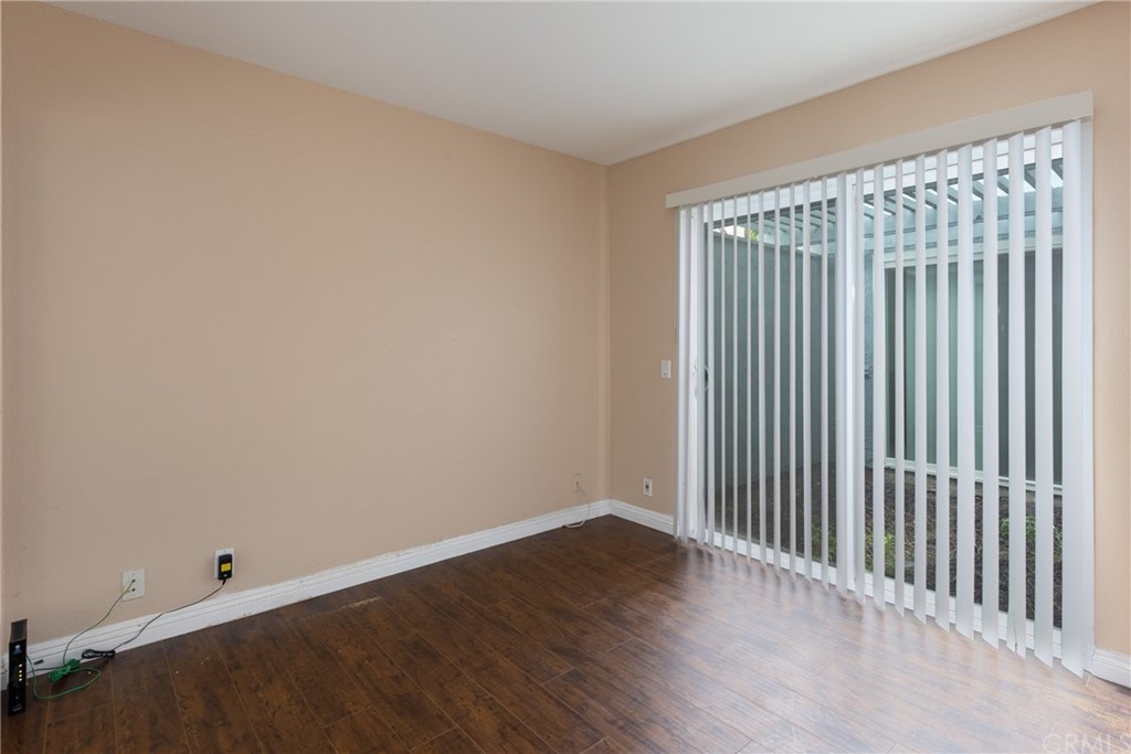 61 Sparrowhawk Irvine, CA 92604 - Photo 15 of 29 an empty room with wooden floor and windows