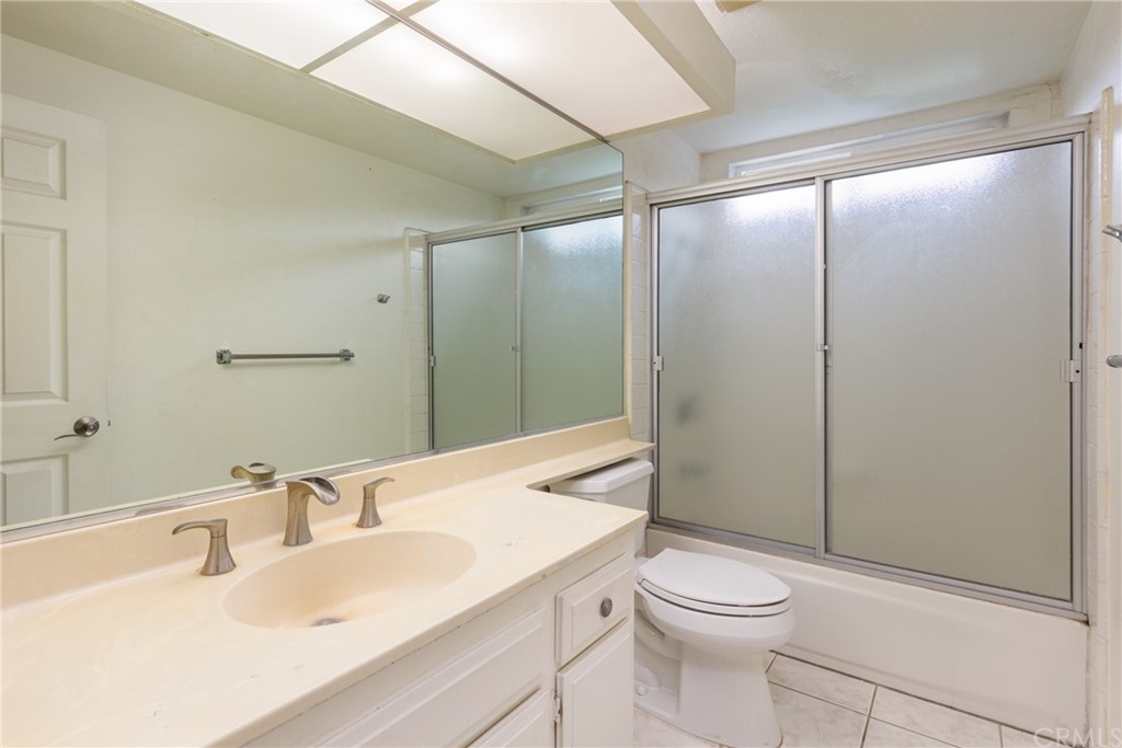 61 Sparrowhawk Irvine, CA 92604 - Photo 16 of 29 a bathroom with a sink a toilet and shower