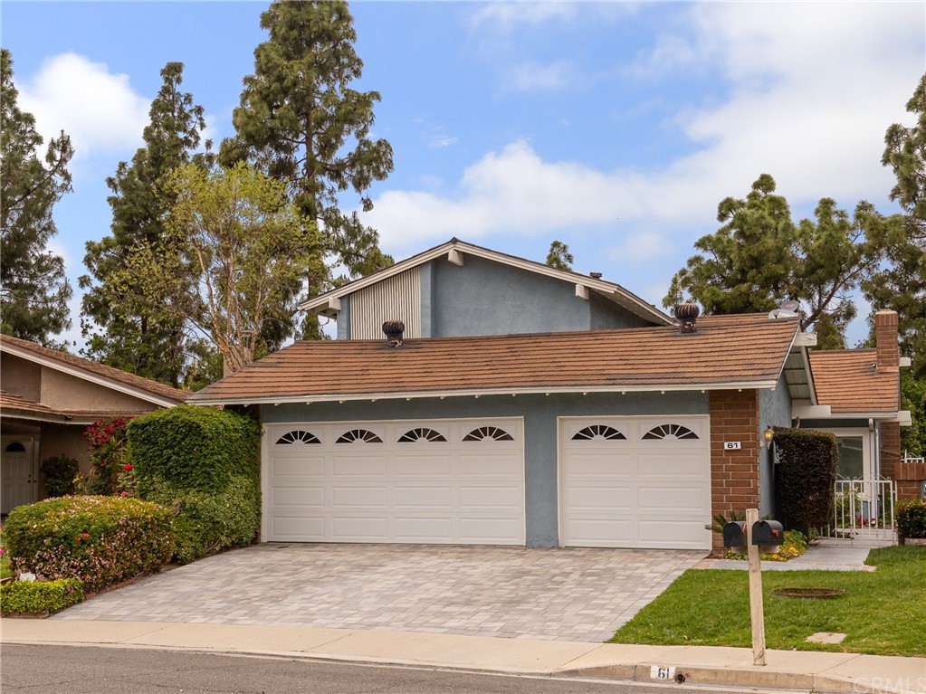 61 Sparrowhawk Irvine, CA 92604 - Photo 2 of 29 a front view of a house with garden