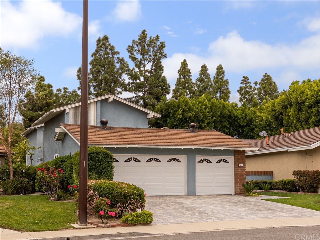 61 Sparrowhawk Irvine, CA 92604 - Photo 3 of 29 a view of a white house with a yard and plants