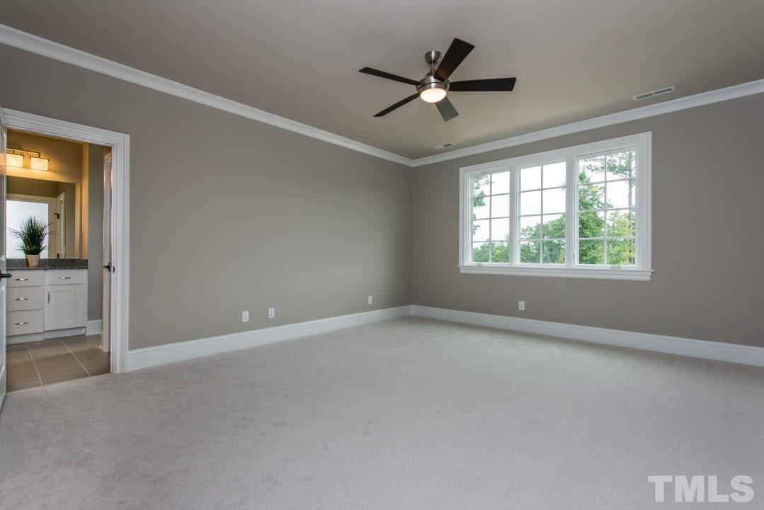 11005 Soco Gap Court Raleigh, NC 27613 - Photo 18 of 25 an empty room with windows and fan