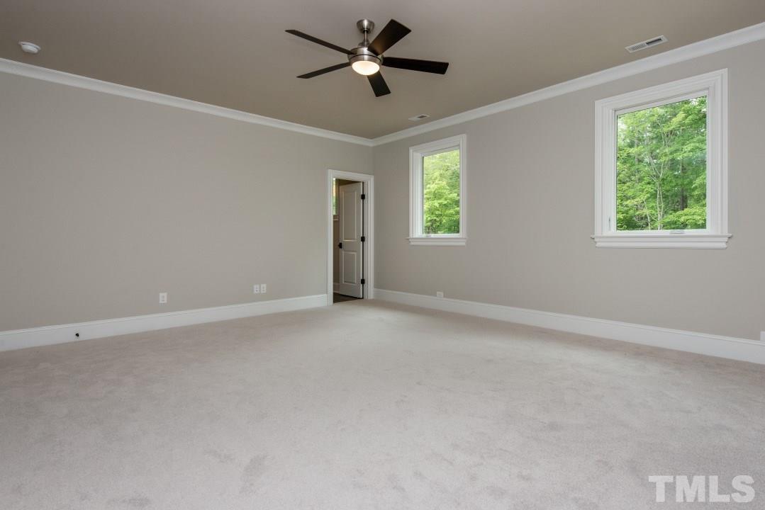 11005 Soco Gap Court Raleigh, NC 27613 - Photo 20 of 25 an empty room with a window and a ceiling fan