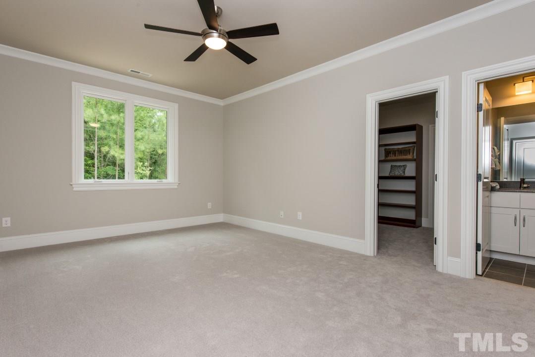 11005 Soco Gap Court Raleigh, NC 27613 - Photo 22 of 25 wooden floor in an empty room with a window