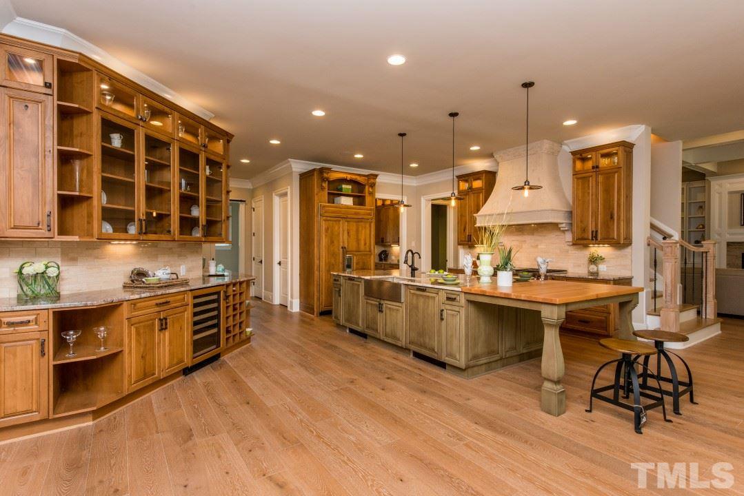 11005 Soco Gap Court Raleigh, NC 27613 - Photo 6 of 25 a large kitchen with a large counter top appliances and cabinets