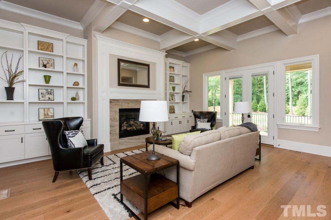 11005 Soco Gap Court Raleigh, NC 27613 - Photo 10 of 25 a living room with furniture and a fireplace