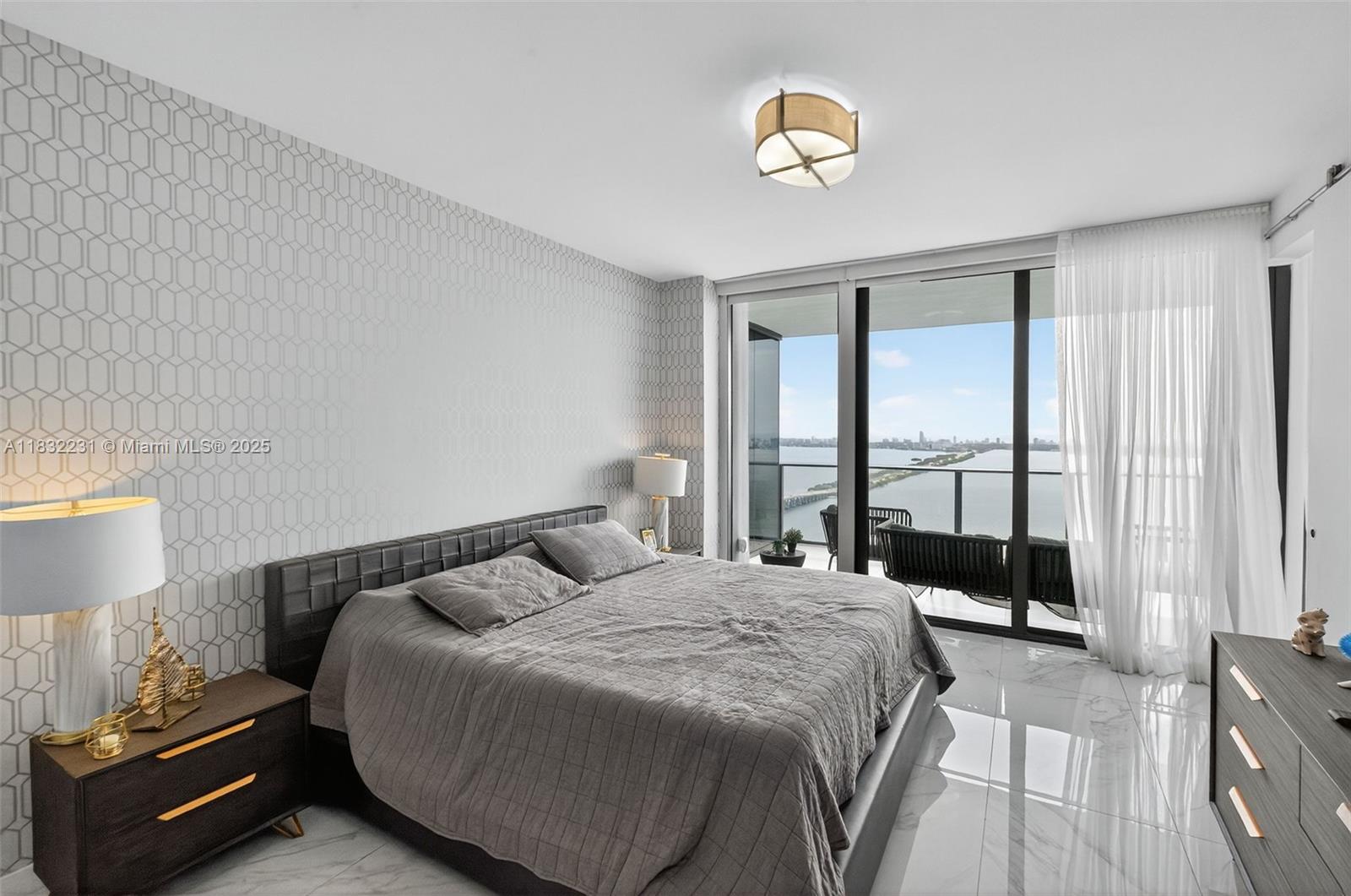 3131 Northeast 7th Avenue, Unit 4503 Miami, FL 33137 - Photo 16 of 51 a bedroom with a bed and a window