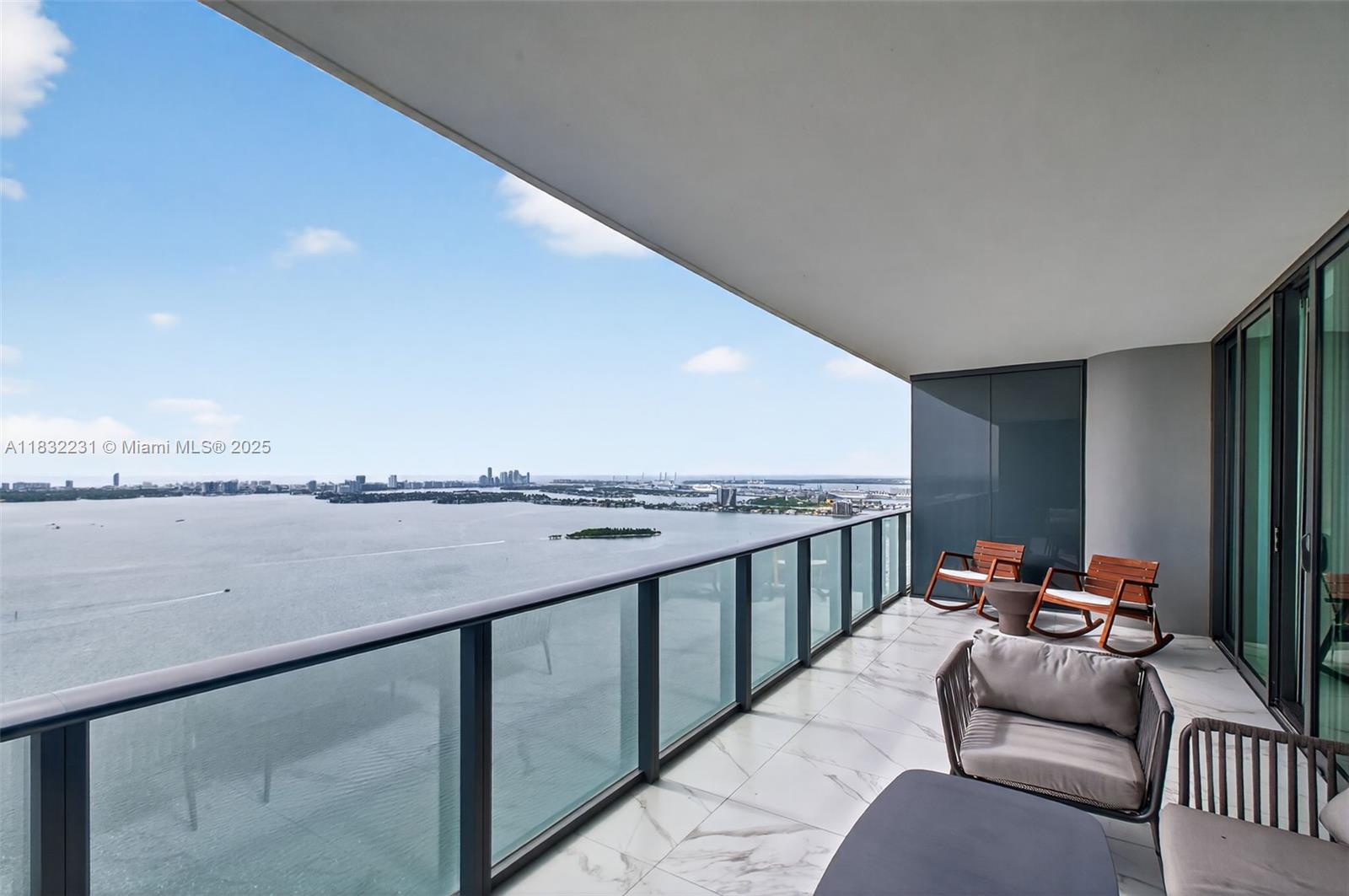 3131 Northeast 7th Avenue, Unit 4503 Miami, FL 33137 - Photo 19 of 51 a balcony with furniture and city view