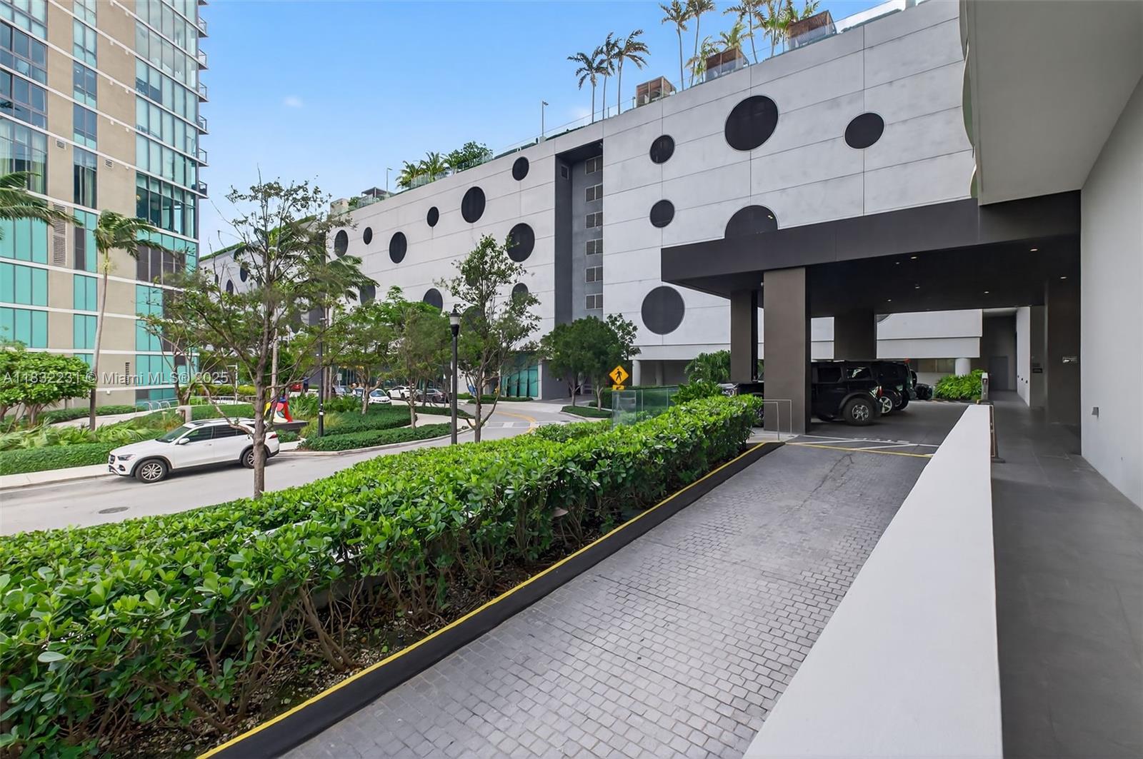 3131 Northeast 7th Avenue, Unit 4503 Miami, FL 33137 - Photo 2 of 51 a view of a garden with a bench