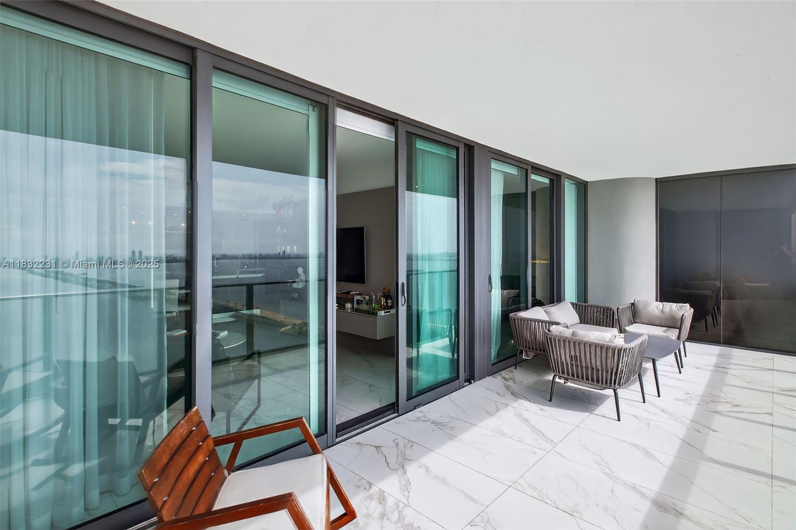 3131 Northeast 7th Avenue, Unit 4503 Miami, FL 33137 - Photo 21 of 51 a balcony with furniture and a potted plant