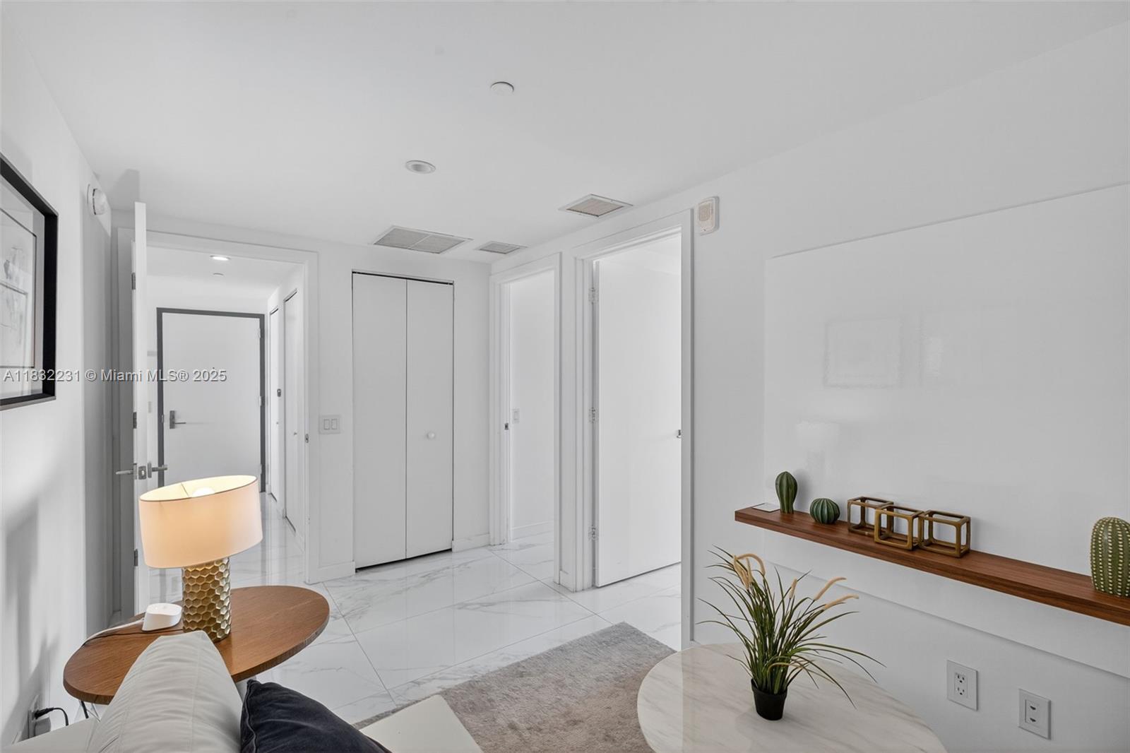 3131 Northeast 7th Avenue, Unit 4503 Miami, FL 33137 - Photo 25 of 51 a living room with furniture and a potted plant