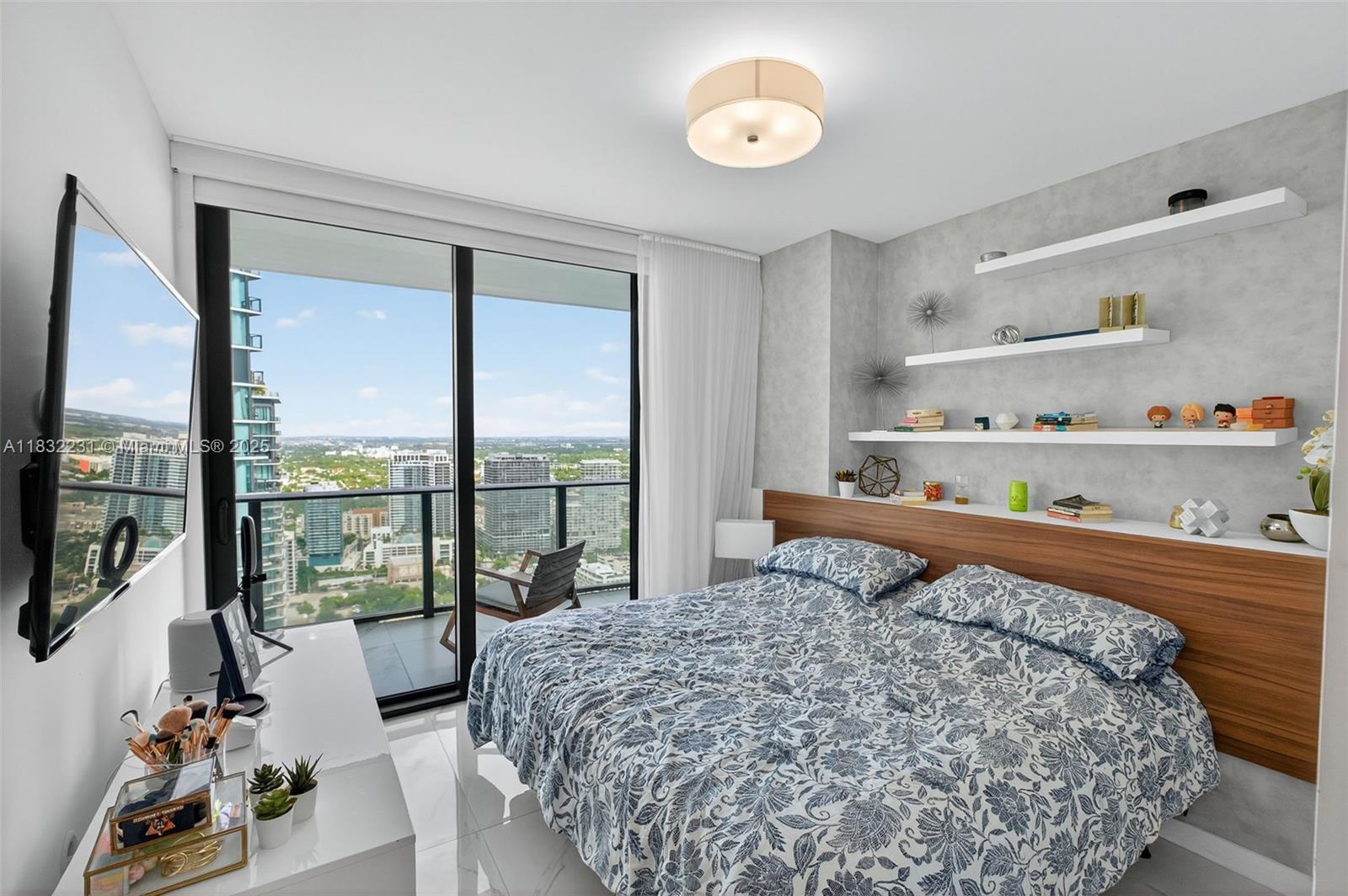 3131 Northeast 7th Avenue, Unit 4503 Miami, FL 33137 - Photo 26 of 51 a bedroom with a bed and a large window with the outer view