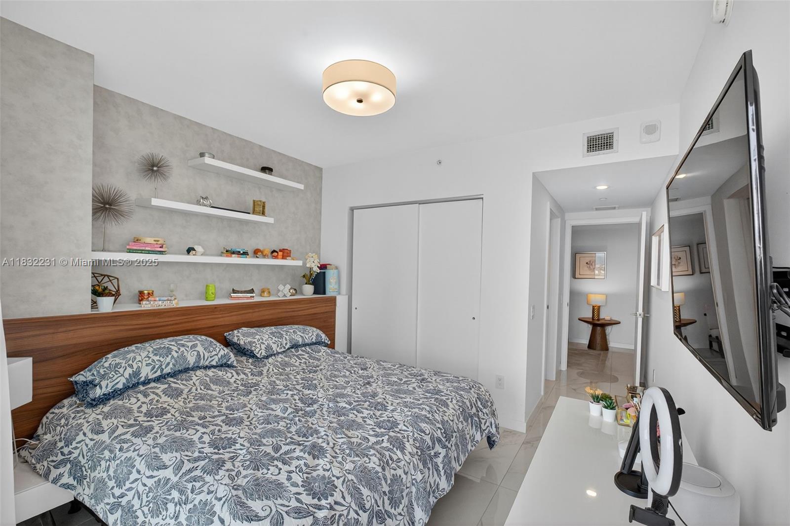 3131 Northeast 7th Avenue, Unit 4503 Miami, FL 33137 - Photo 27 of 51 a bedroom with a bed and a dresser