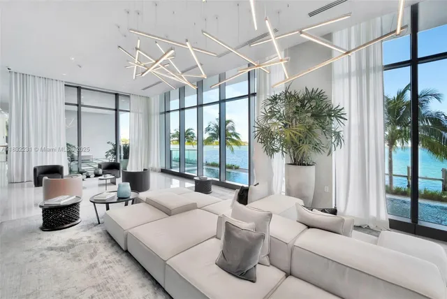 a view of swimming pool with outdoor seating and plants