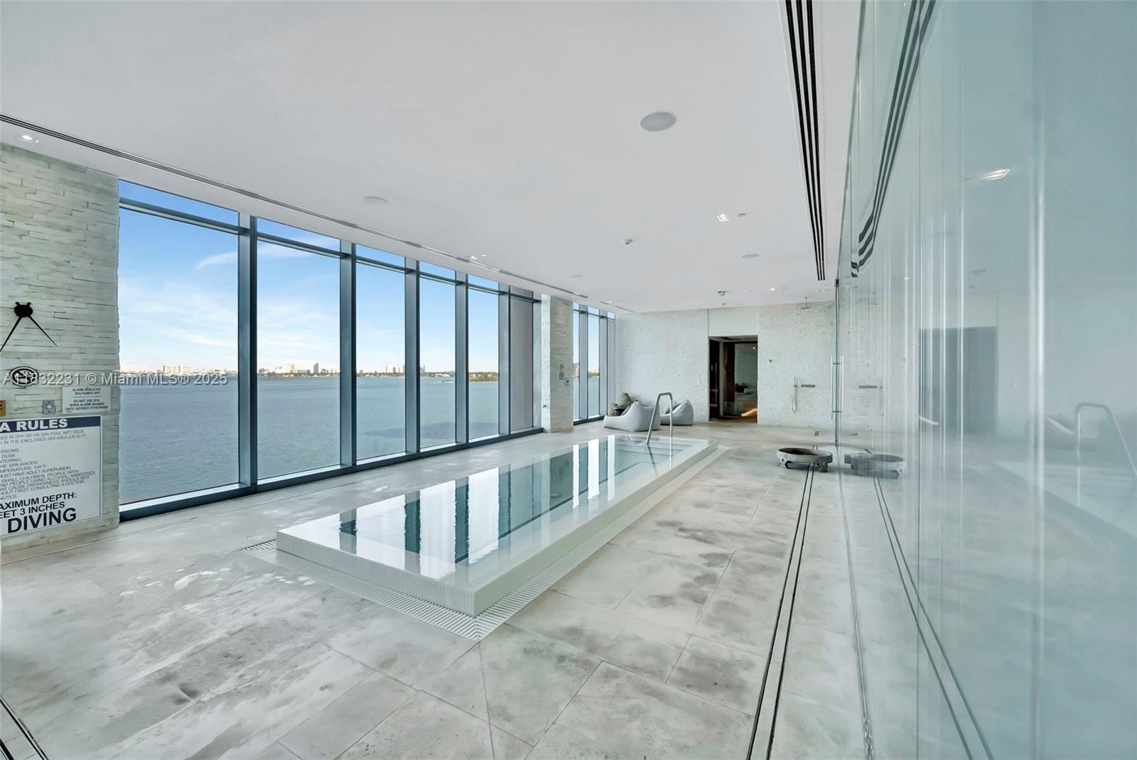 3131 Northeast 7th Avenue, Unit 4503 Miami, FL 33137 - Photo 40 of 51 a view of staircase with white walls and windows