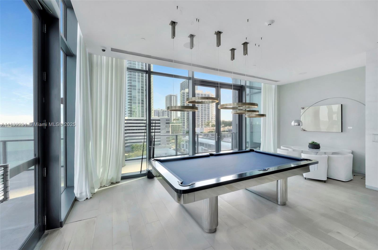3131 Northeast 7th Avenue, Unit 4503 Miami, FL 33137 - Photo 48 of 51 a room with pool table and windows