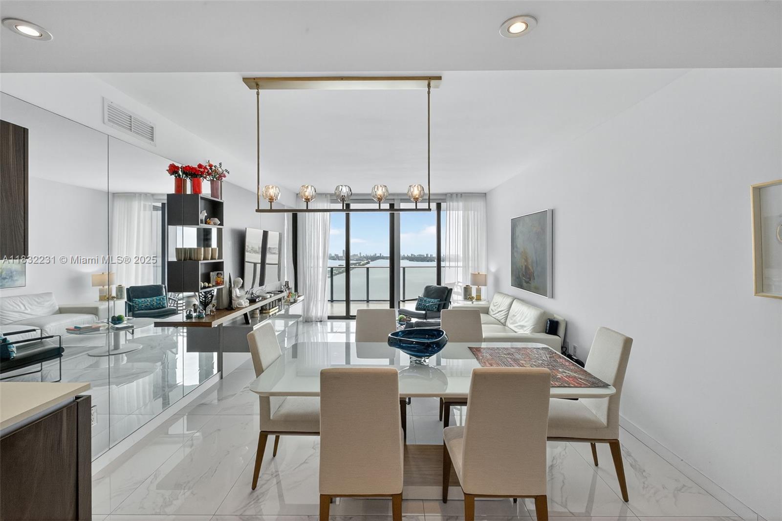 3131 Northeast 7th Avenue, Unit 4503 Miami, FL 33137 - Photo 7 of 51 a view of a dining room with furniture water view and large windows