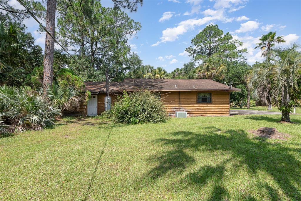 4300 Justa Road Mims, FL 32754 - Photo 45 of 61 a swimming pool with trees in the background