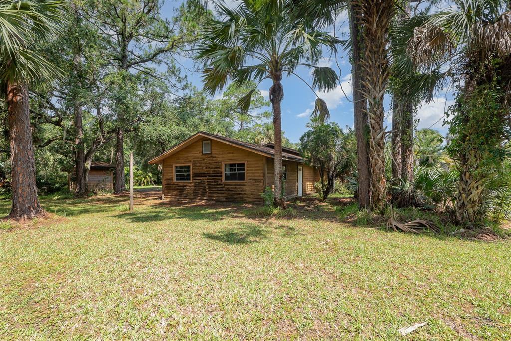 4300 Justa Road Mims, FL 32754 - Photo 46 of 61 a front view of a house with a yard