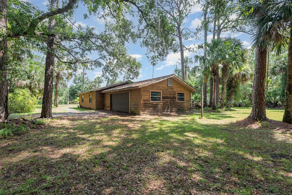 4300 Justa Road Mims, FL 32754 - Photo 47 of 61 a front view of a house with garden