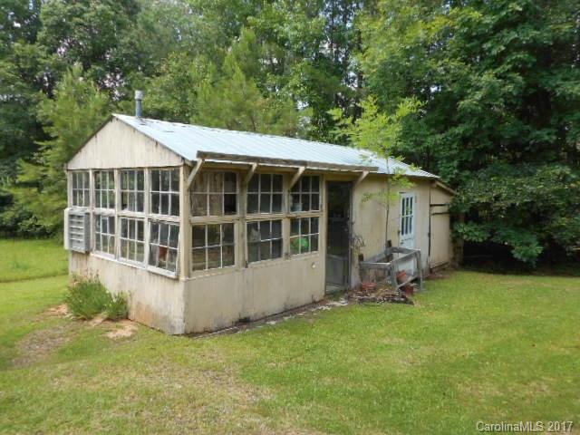 1007 Old Thompson Avenue Lancaster, SC 29720 - Photo 12 of 13 a view of a house with backyard sitting area and garden