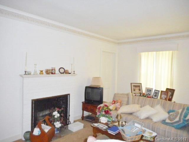 1007 Old Thompson Avenue Lancaster, SC 29720 - Photo 6 of 13 a living room with furniture and a fireplace