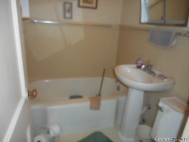 1007 Old Thompson Avenue Lancaster, SC 29720 - Photo 7 of 13 a bathroom with a sink a toilet and shower