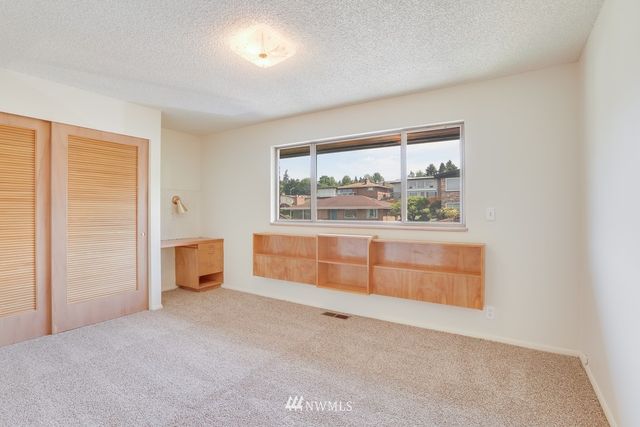 an empty room with large window