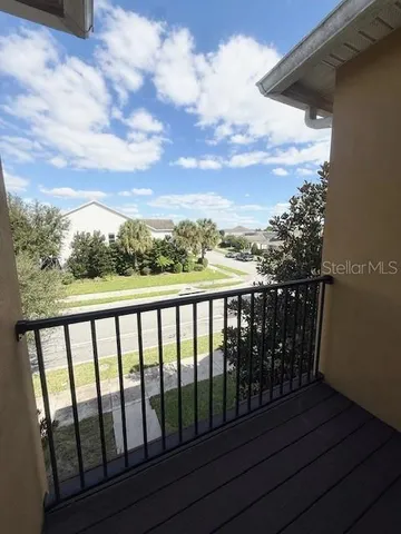 a view of a patio with a table chairs and a patio