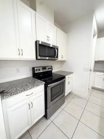 a view of a entryway with kitchen