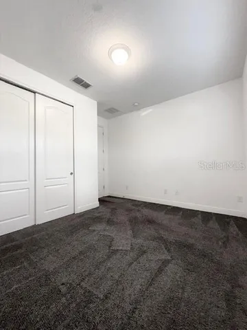 an empty room with a empty space and a window