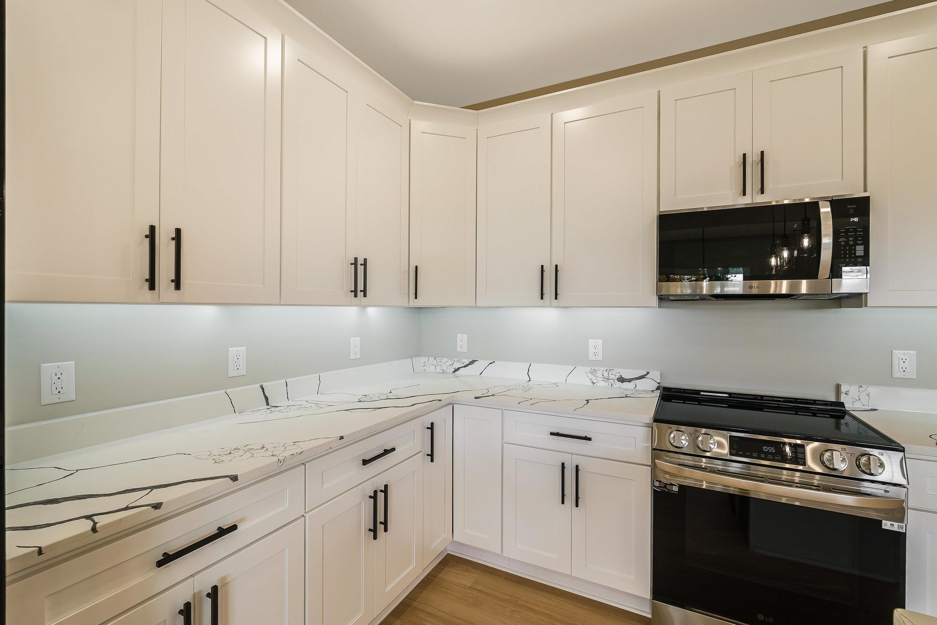 4935 Boxer Loop McGaheysville, VA 22840 - Photo 16 of 60 a kitchen with stainless steel appliances granite countertop white cabinets a sink and dishwasher