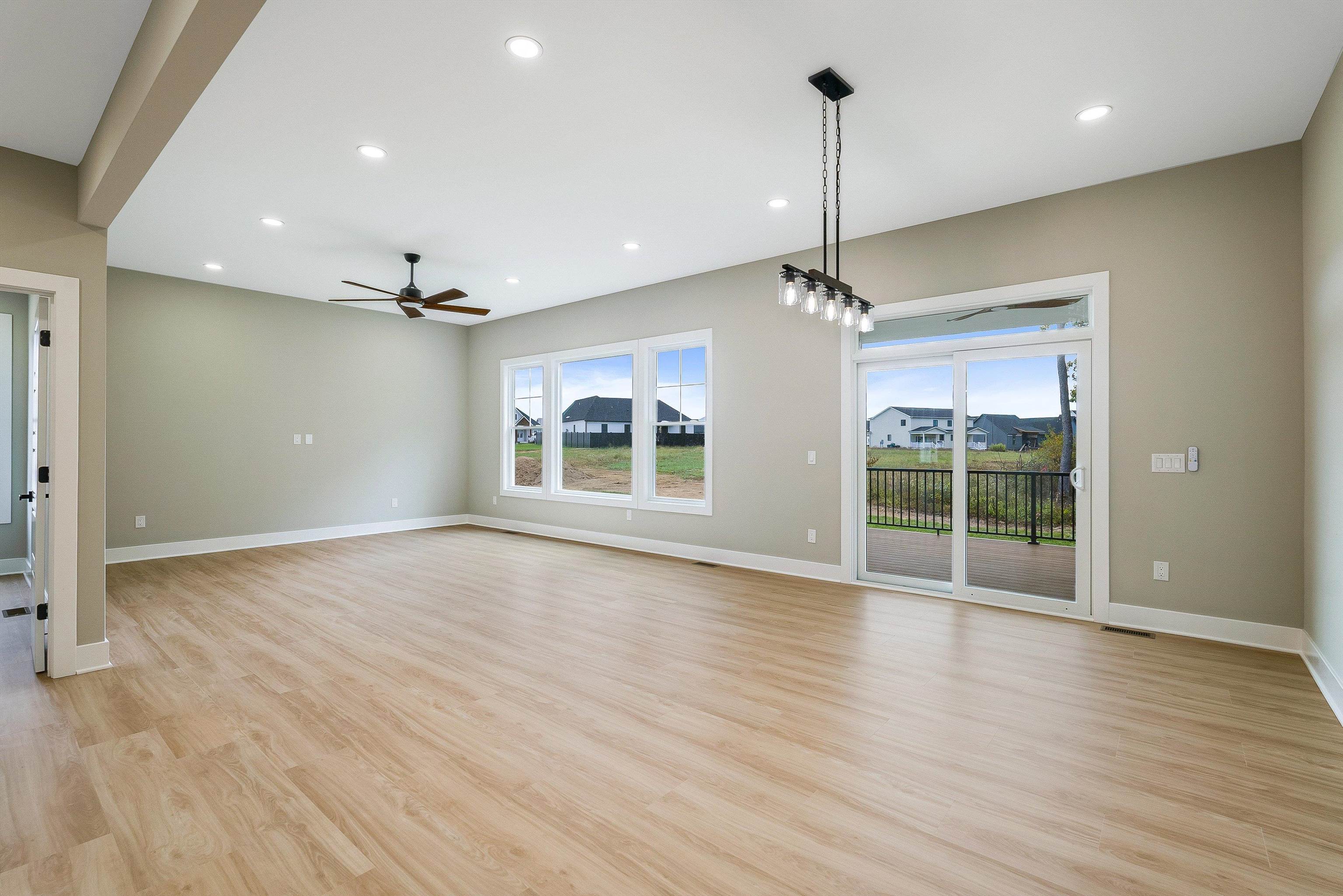 4935 Boxer Loop McGaheysville, VA 22840 - Photo 19 of 60 a view of an empty room with wooden floor and a window